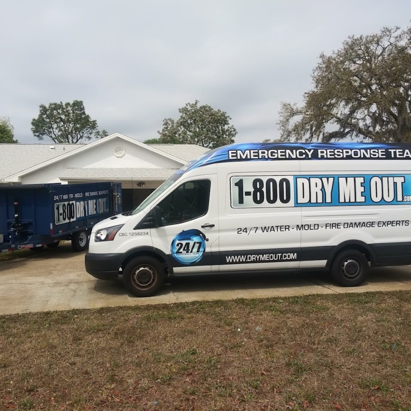 1-800 Dry Me Out truck arriving at a property